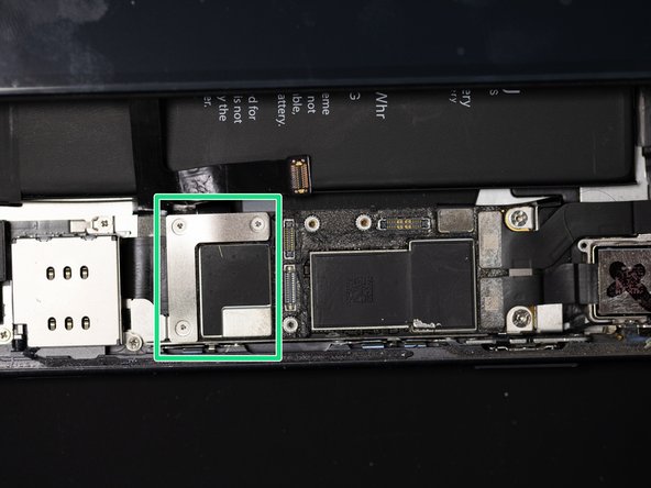 Screw the battery and charging port shield back down.