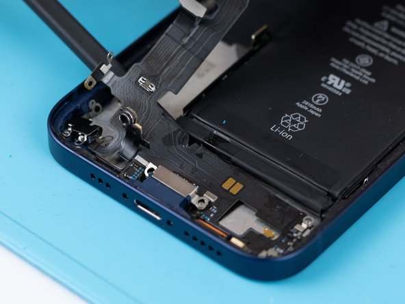 Use a spudger to lift the charge port flex away from the phone case.