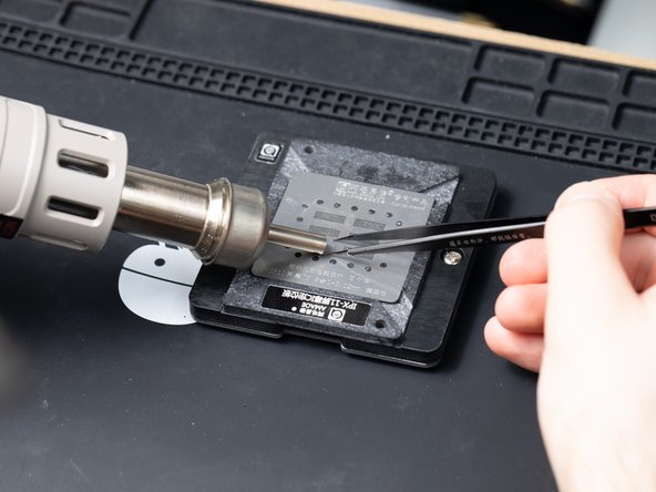 Hold the stencil with tweezers to stop it moving.