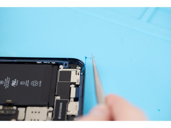 Peel away the thin protective strips that are stuck to the adhesive. Remove all the strips that are stuck to the parameters of the phone.