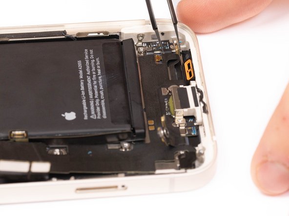 Using tweezers, remove the third microphone from it's socket.