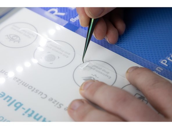 Remove the film cut for the home button and also for the speaker and cameras at the top of your iPad.