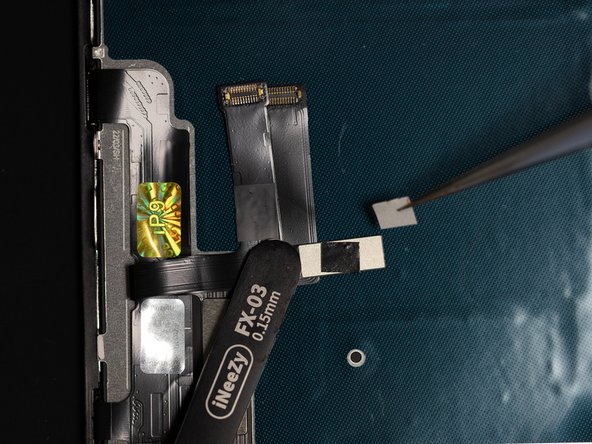 Cut a small square of Tesa Tape and using tweezers apply it to the back of the flex.