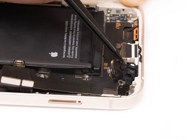 Remove the plastic bracket holding the microphones down.