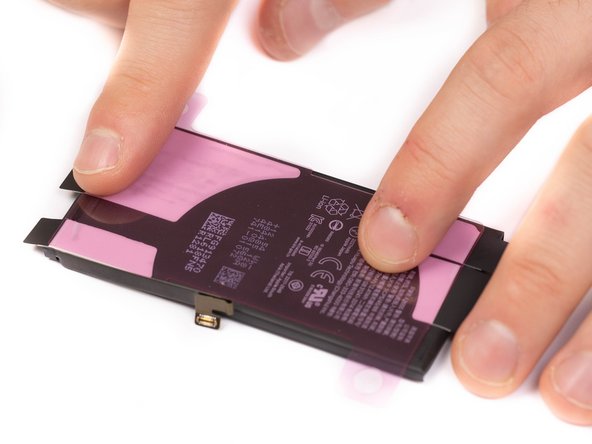 Using your fingers, firmly press the adhesive strips into place.