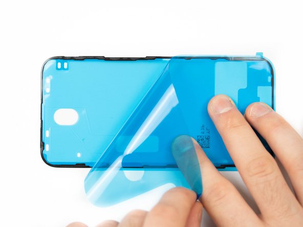 Peel away the protective cover for your adhesive. There will be a tab sticking out, use that to pull from.