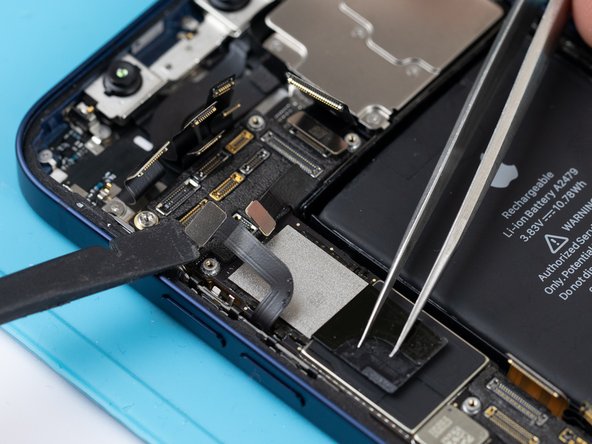 Using a spudger or your fingernail, disconnect the power volume NFC flex.