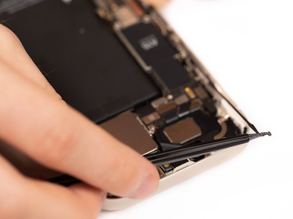 Start by removing the old adhesive that's located around the parameters of your iPhone chassis.