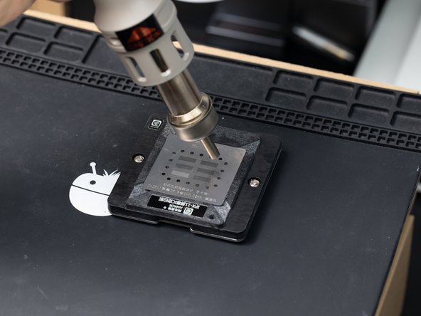 Set your hot air station to 350°C with airflow set to 70. Heat around the solder paste and heat the stencil in circular motions.