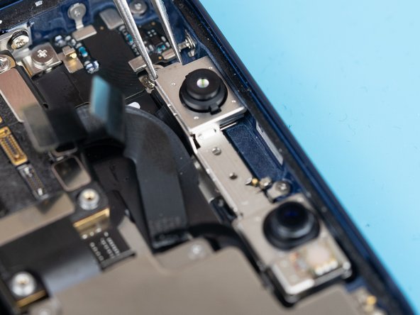 Use a tweezer to lift the infrared camera out from underneath the frame.