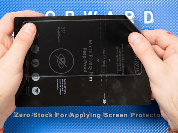 Peel off the cut from the backing sheet. Bending the sheet will help peel the cut off.