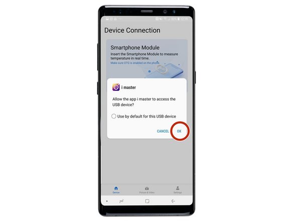When you plug the camera into the bottom of your phone there'll be a pop up message to allow the USB device to have access to your device. Click 'Ok'.