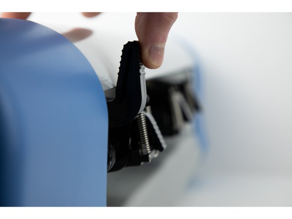 Push the main latch back up and the roller wheel latch back down. This will secure the roller wheel in its new position.