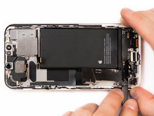 Apply a small amount of IPA to loosen the charge port. This will help you lift it up from the phone case.