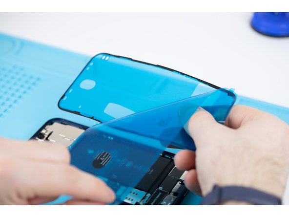 Peel away the protective cover for your adhesive. There will be a tab sticking out, use that to pull from.