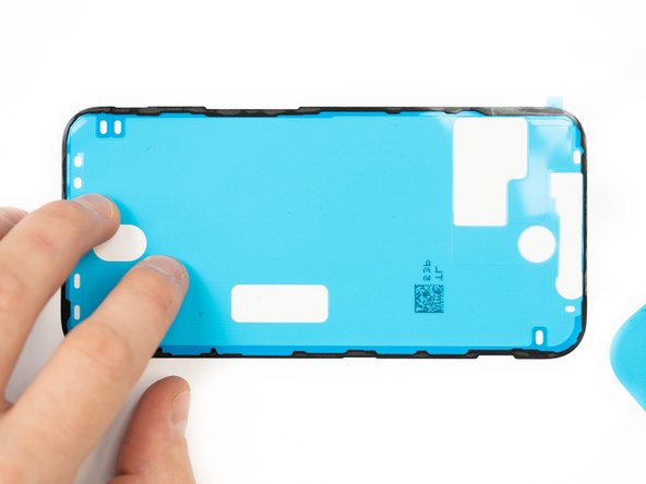 Peel away the protective cover for your adhesive. There will be a tab sticking out, use that to pull from.