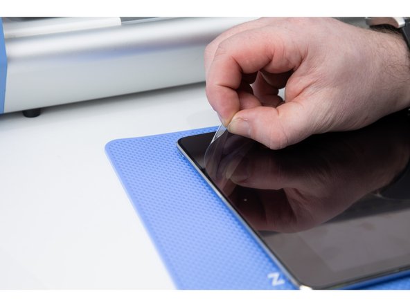 Theres a protective layer on the film. Peel it away.