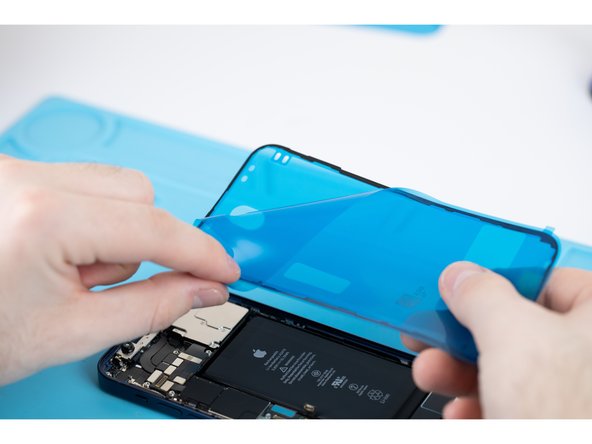 Peel away the protective cover for your adhesive. There will be a tab sticking out, use that to pull from.