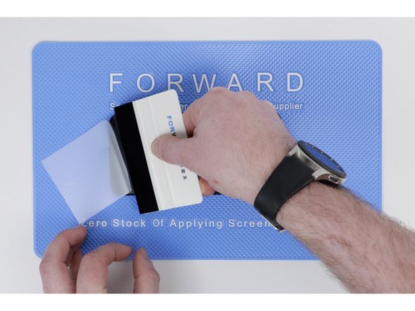 Once applied, go over the section you've applied with a application tool and press out any bubbles.