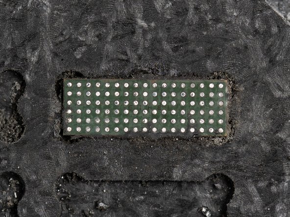 Clean the IC with some IPA using a cotton bud. This will ensure all of the underfill glue has been removed.