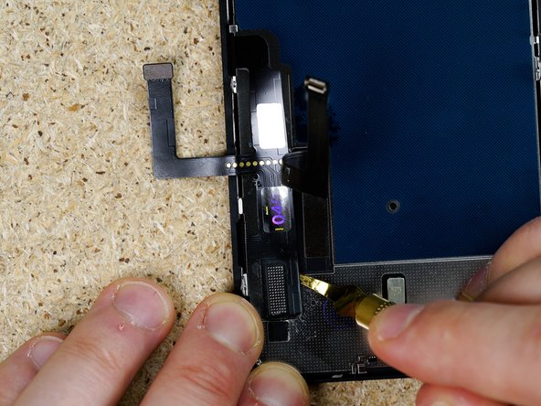 Continue working your way down the flex prying gently in a back and forth motion.