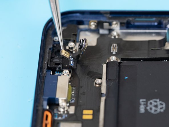 Using a tweezer, disconnect the second microphone from its socket.