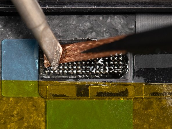 Rub the solder wick across the flex until the joints are flat.