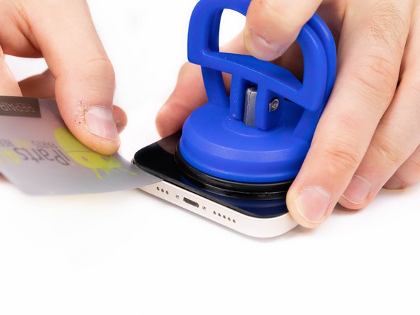 Continue prying the phone open along the left and right side.