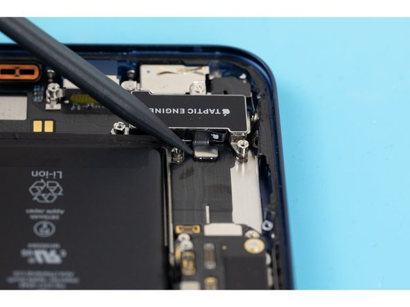 Using the tip of a spudger, pry the taptic engine cable connector out of its socket on the logic board.