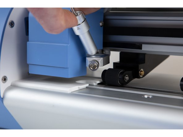 Put the blade holder back into it's original position.