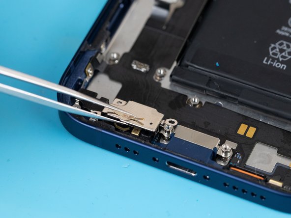 Using a tweezer, pull the protective cover away. The cover is stuck down with an adhesive so you'll need to be firm when removing it.