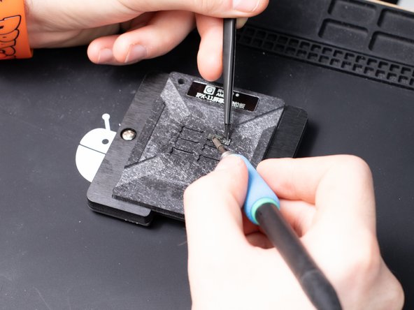 It's best to work your way out to one of the edges of the chip slowly.