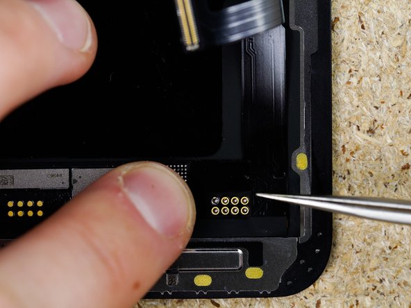 Align your tag on flex with your solder pads on the screen. They should be visible through the holes on the tag on flex.