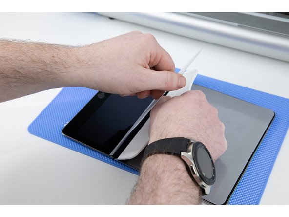 Your film will now be split in two due to your allignment layer being stuck down. Begin by sticking the smaller side of your film down first.