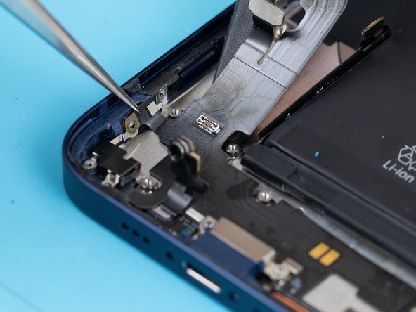 The charge port is loosely attached to the side of the phone case where a screw used to be connected.