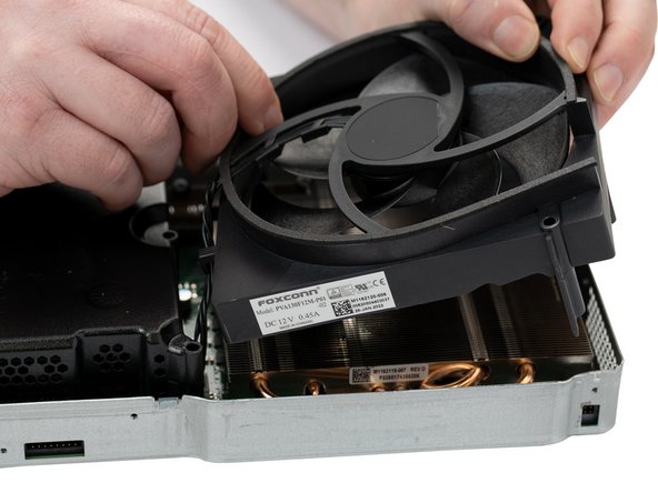 Remove the fan from the motherboard by lifting it straight up.