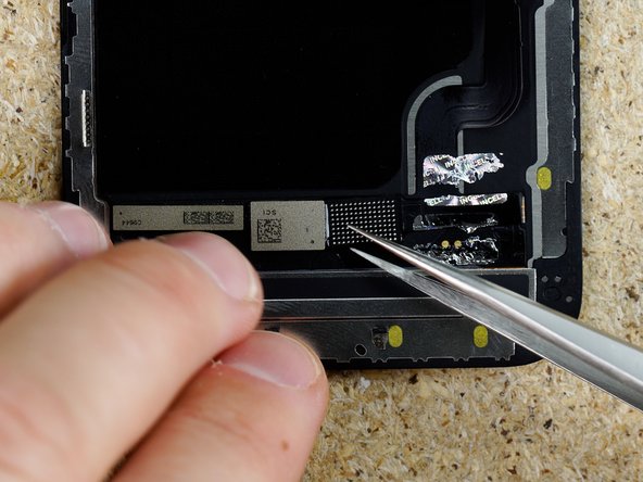 Using IPA &amp; tweezers pry the flex away from the display.
