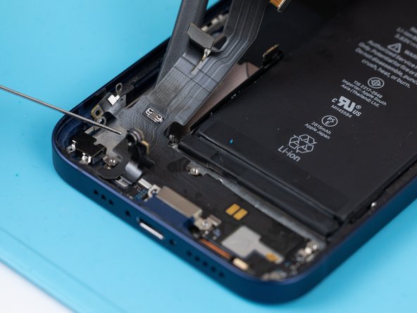 Apply a small amount of IPA to loosen the charge port. This will help you lift it up from the phone case.