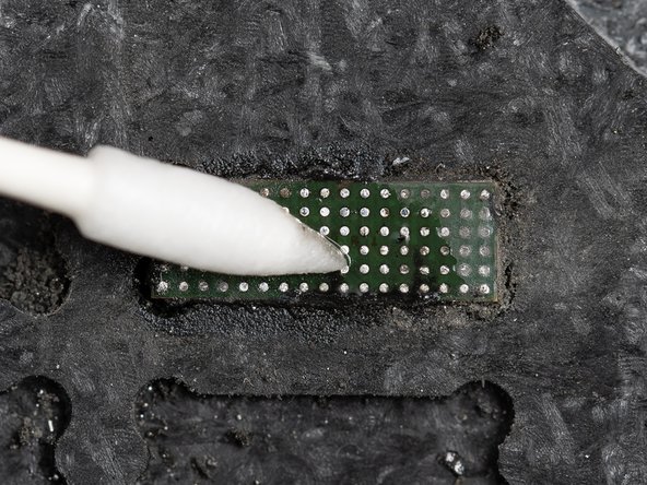 Clean the IC with some IPA using a cotton bud. This will ensure all of the underfill glue has been removed.