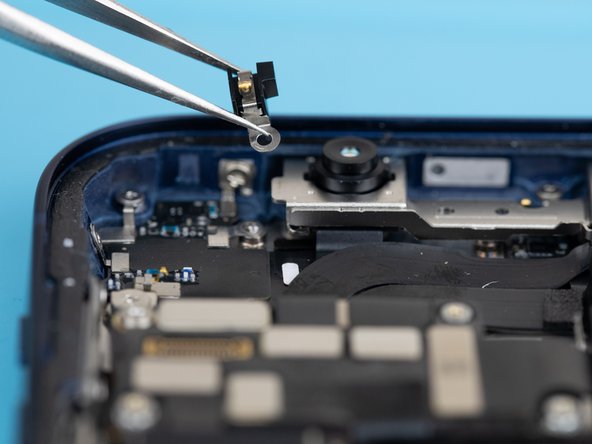 After removing the screw in the previous step, you'll be able to remove the front-facing camera bracket with a tweezer.