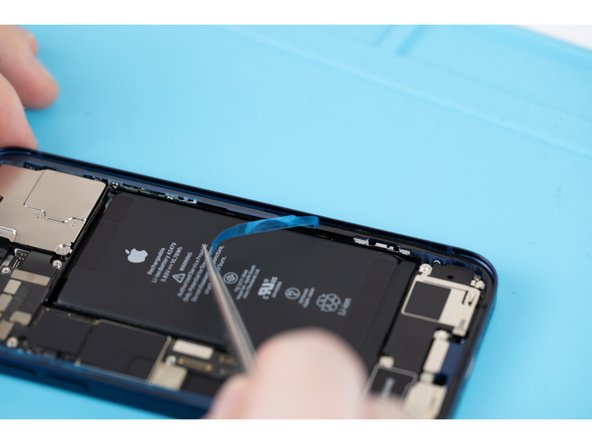 Peel away the thin protective strips that are stuck to the adhesive. Remove all the strips that are stuck to the parameters of the phone.