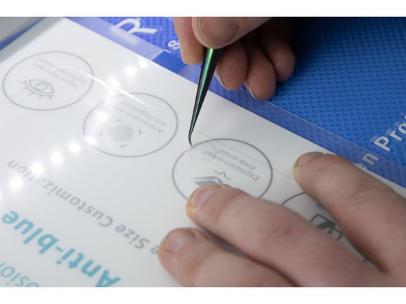 Remove the film cut for the home button and also for the speaker and cameras at the top of your iPad.