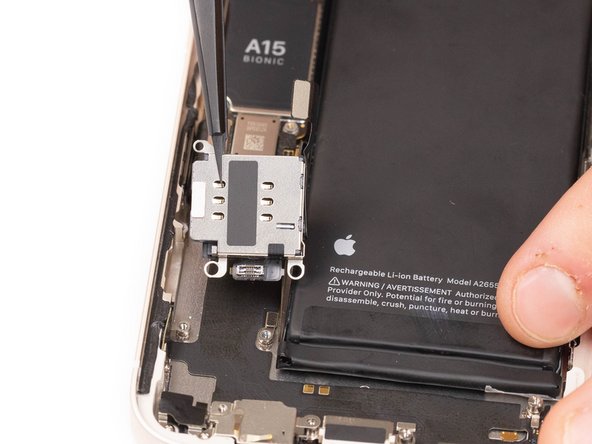 Using tweezers or your fingers, remove the SIM card reader.