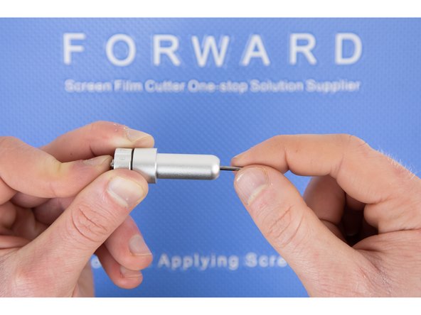 The blade holder will suck the blade in once you have most of the blade pushed in. So there's no need to force the blade, it'll go in easily.