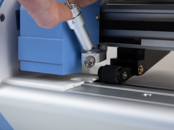 Put the blade holder back into it's original position.