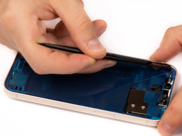 Use a spudger or tweezers to firmly press the adhesive in place across all four corners.