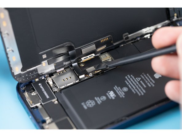 Disconnect the display cable with a spudger or fingernail.
