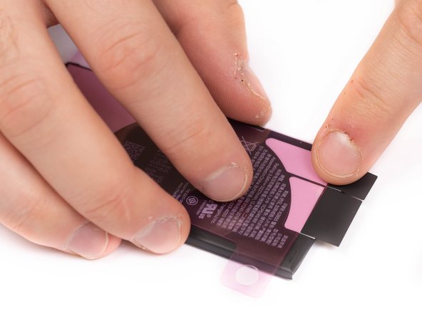 Once the adhesive is suck to the battery, you won't be able to re-position it.