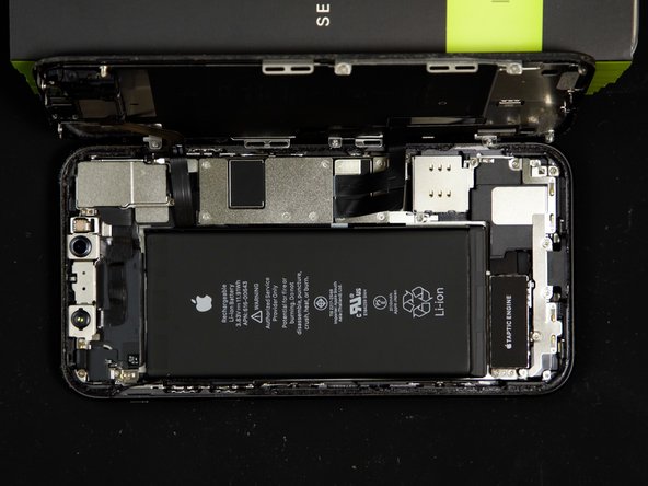 The battery is secured to the case with six stretch-release-adhesives, you'll need to remove these in order to remove the battery.