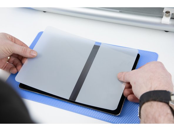 Take your time to line up the film to the corners on your iPad. Make sure there is no overlap on your home button.